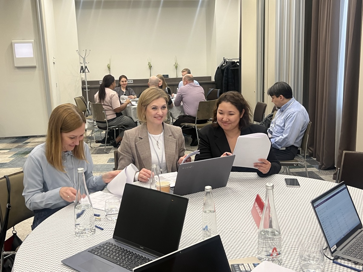 World of Trade participants during team work in the room